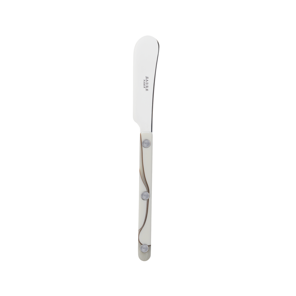 A small butter knife made by Sabre Paris with a white and grey swirl pattern on the handle.