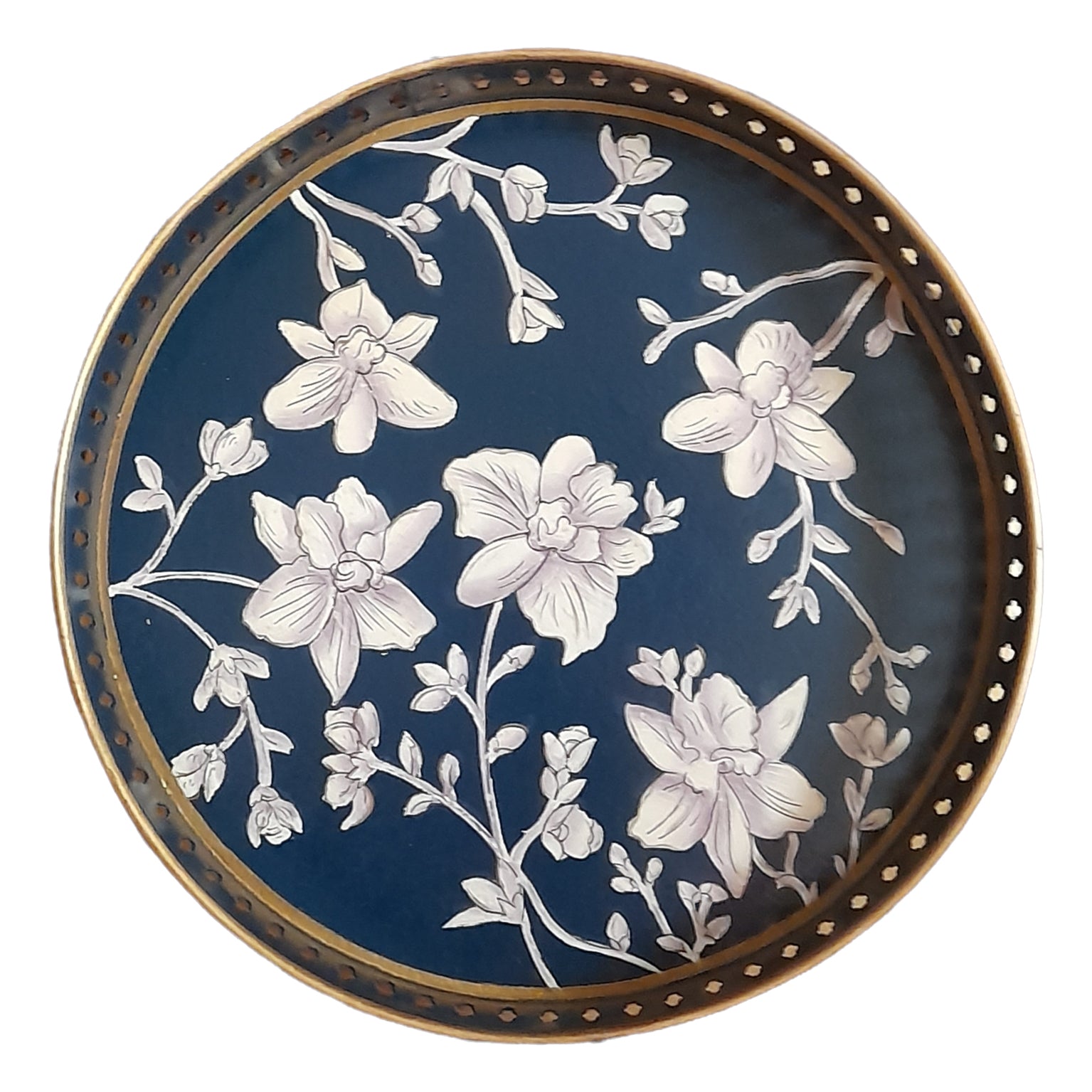 A round iron tray that features a hand-painted illustration of white flowers on a navy-blue background with gold edging.