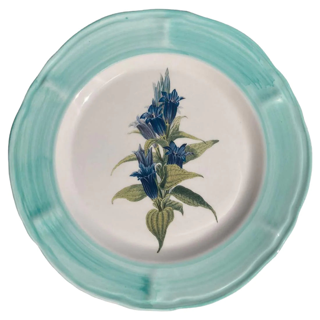 A ceramic plate with a blue flower hand painted in the centre and it is surrounded by a light blue rim.
