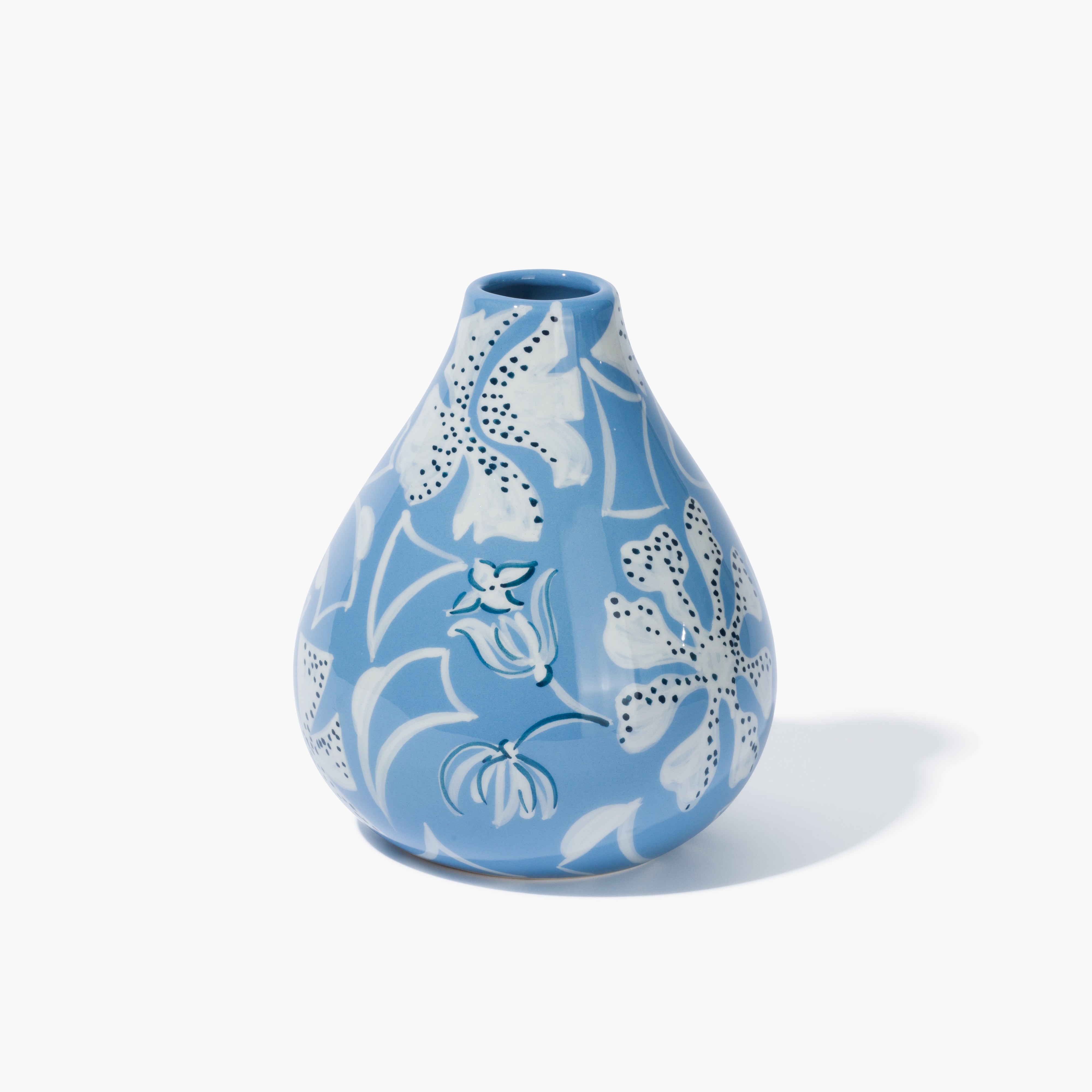 A light blue and white floral patterned base in a  bulb shape with a white pattern on a light blue background.