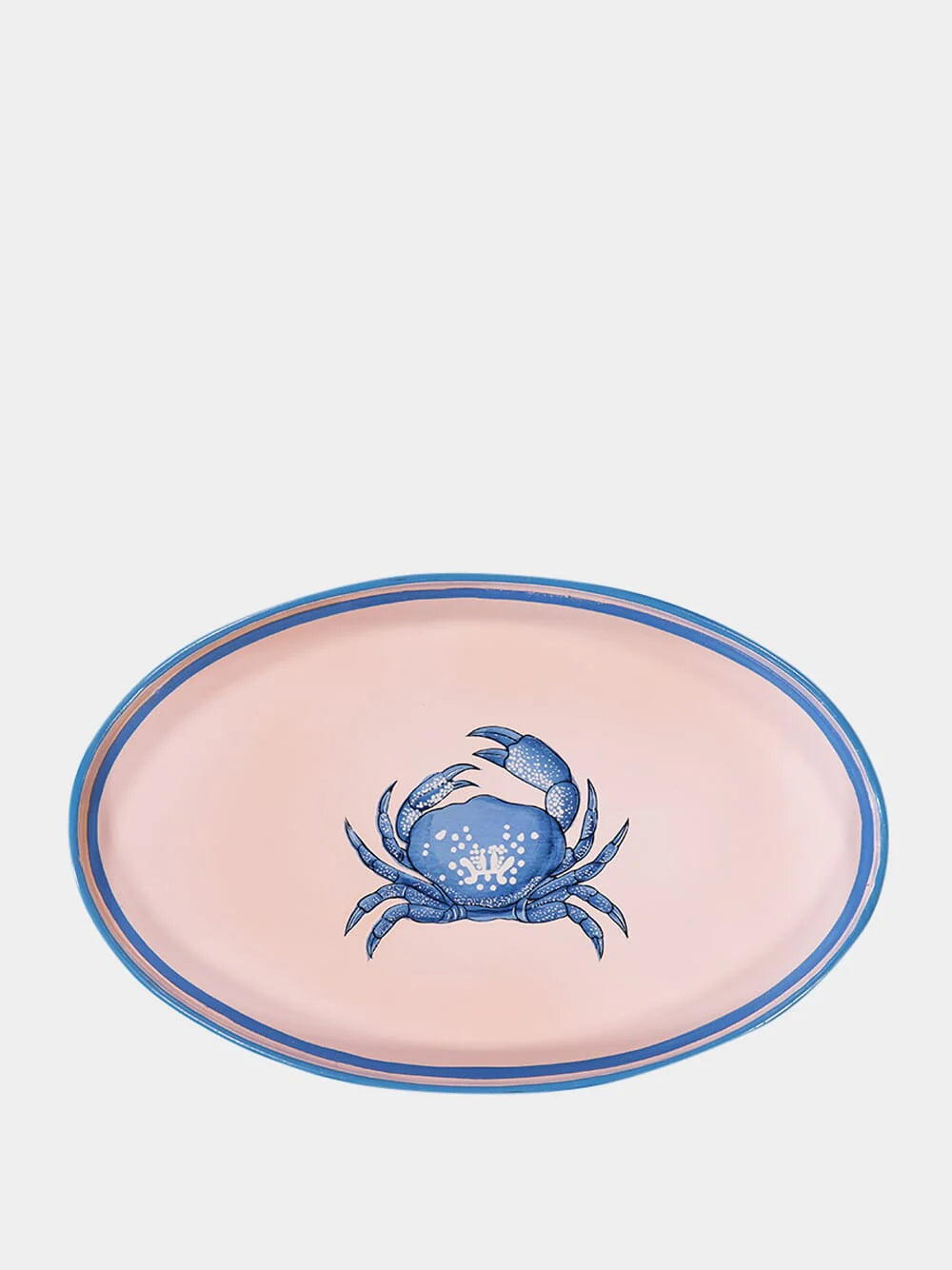 An oval shaped iron tray that features a hand-painted illustration of blue crab on a pink background. 