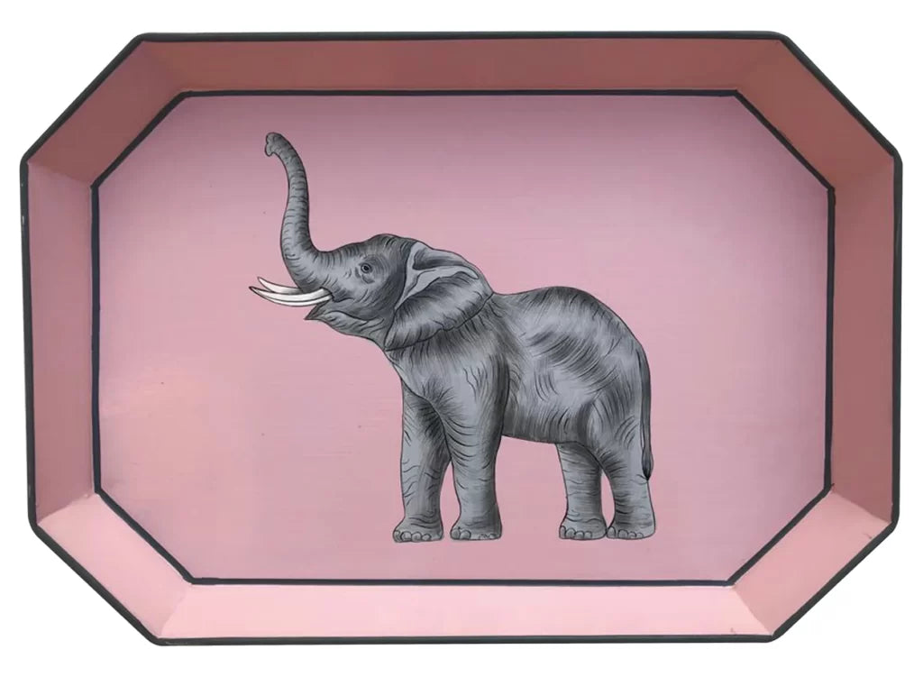 A rectangular shaped iron tray that features a hand-painted illustration of an elephant with its trunk raised on a pink background.