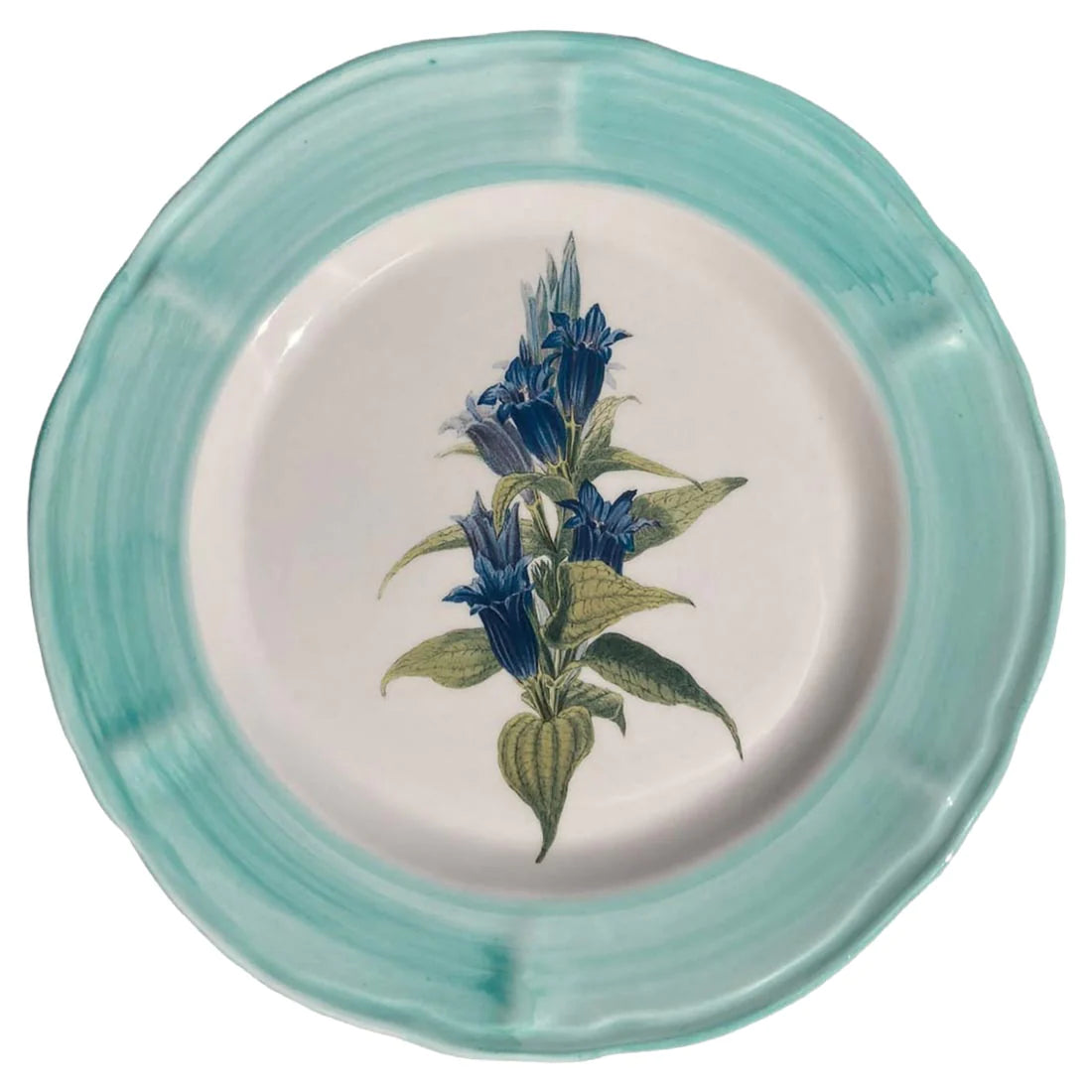A ceramic plate with a blue flower hand painted in the centre and it is surrounded by a light blue rim. 