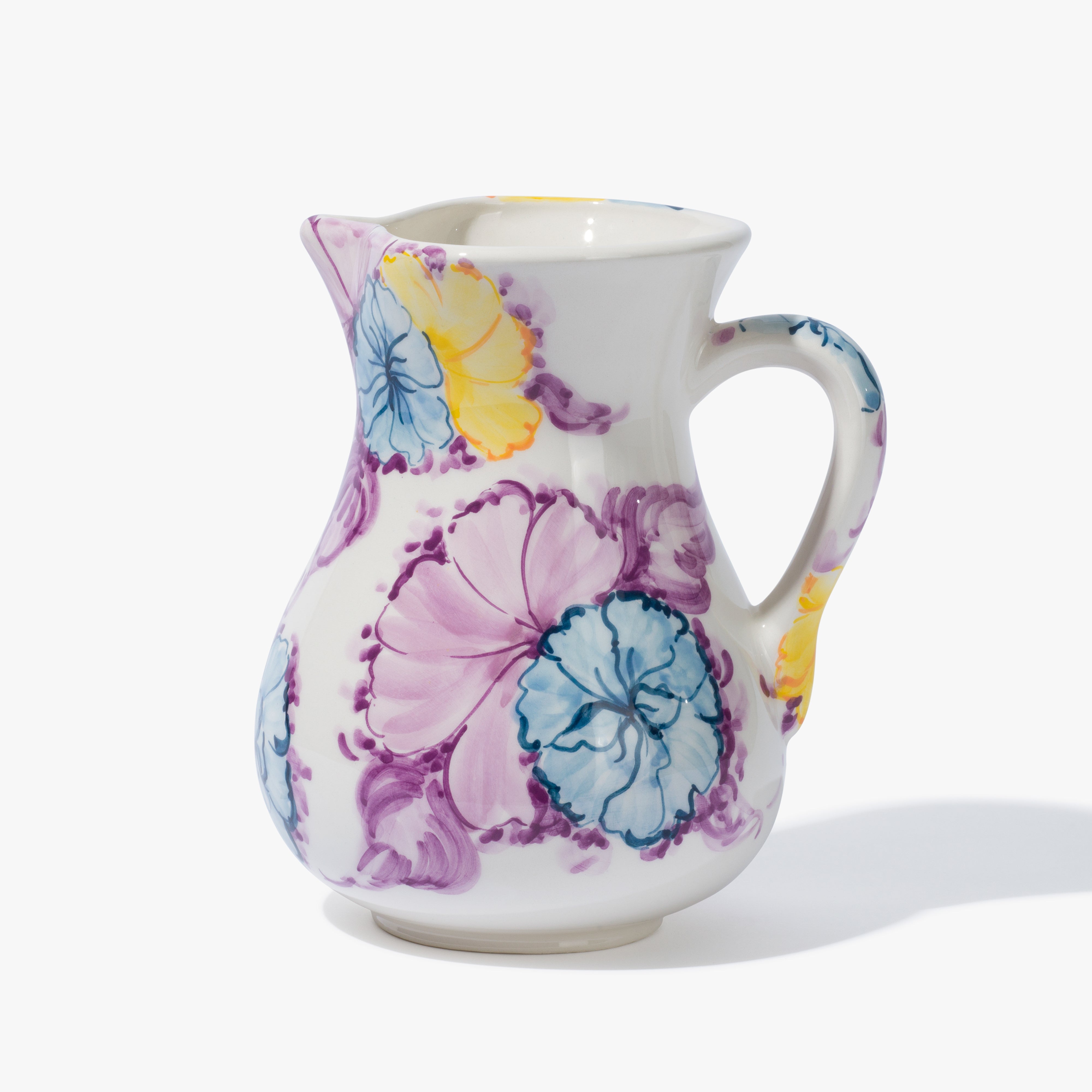 A vaisselle jughead just which is a classic jug shape with a handle and a unique hand-painted watercolour floral design in blue, lavender and yellow. 